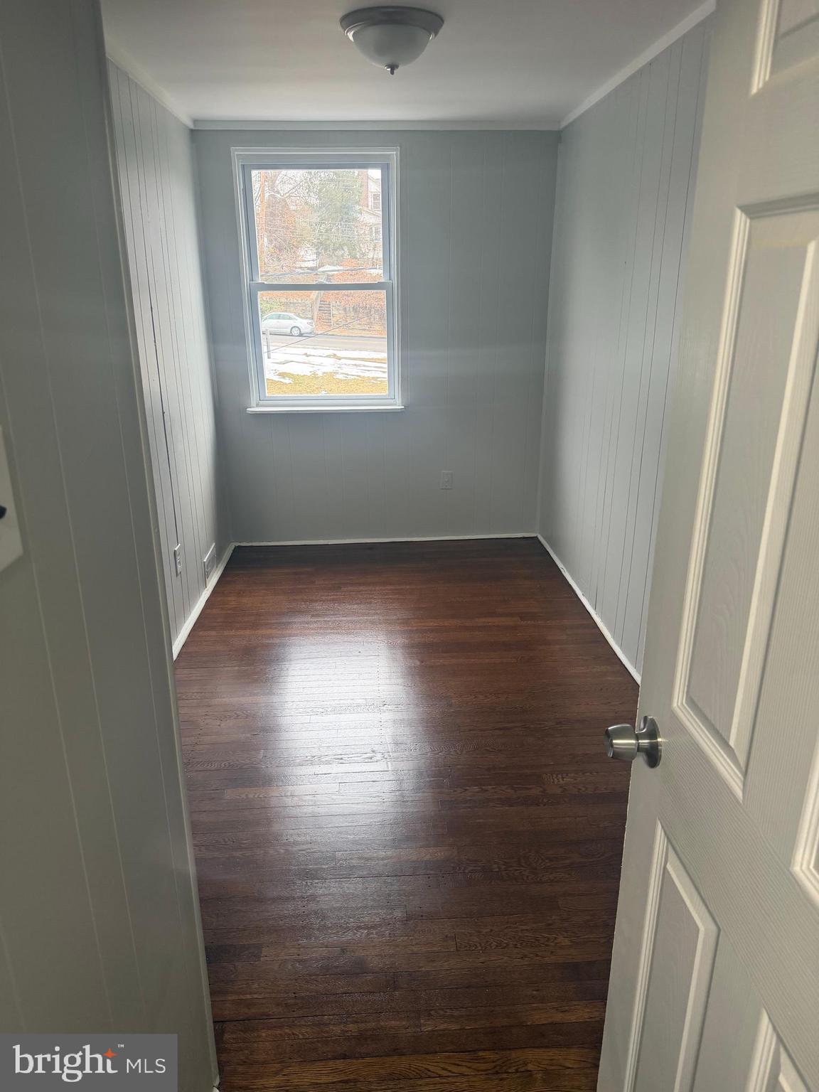 203 Cambridge Road Clifton Heights, PA 19018 - Photo 12 of 13 a view of an empty room with wooden floor and a window