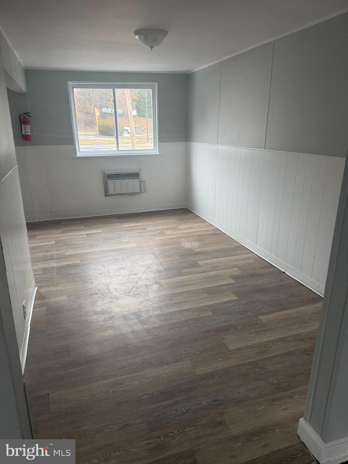 203 Cambridge Road Clifton Heights, PA 19018 - Photo 4 of 13 a view of empty room with wooden floor and fan