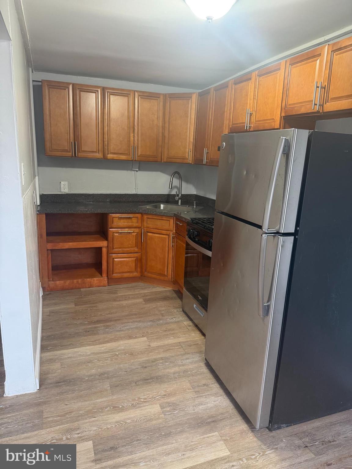 203 Cambridge Road Clifton Heights, PA 19018 - Photo 6 of 13 a kitchen with stainless steel appliances granite countertop a refrigerator and a sink