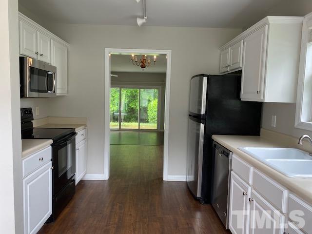 209 Harris Road Wake Forest, NC 27587 - Photo 3 of 9 a kitchen with a sink dishwasher a refrigerator and a stove