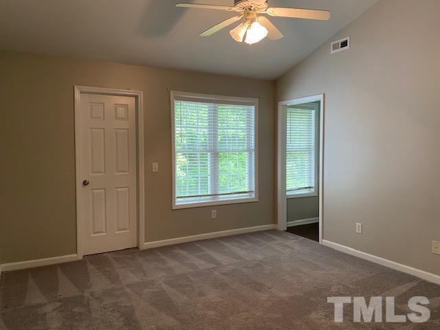 209 Harris Road Wake Forest, NC 27587 - Photo 7 of 9 a view of an empty room with a window