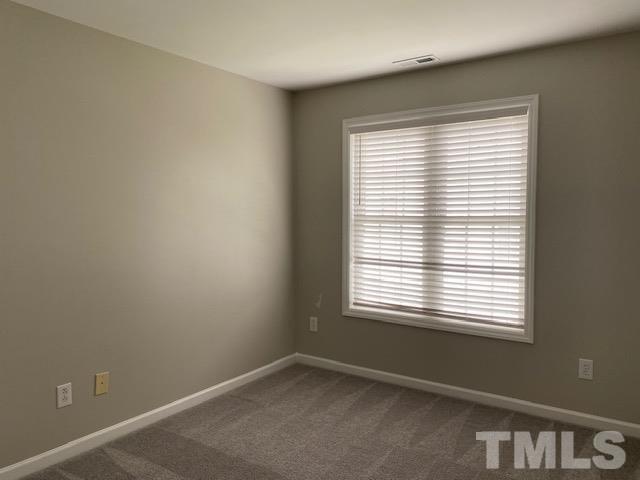 209 Harris Road Wake Forest, NC 27587 - Photo 8 of 9 an empty room with a window