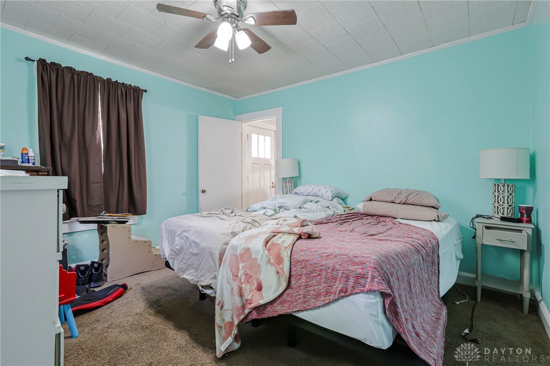 2390 Ridge Road Zanesville, OH 43701 - Photo 19 of 45 This spacious bedroom offers ample comfort and a cozy ambiance.