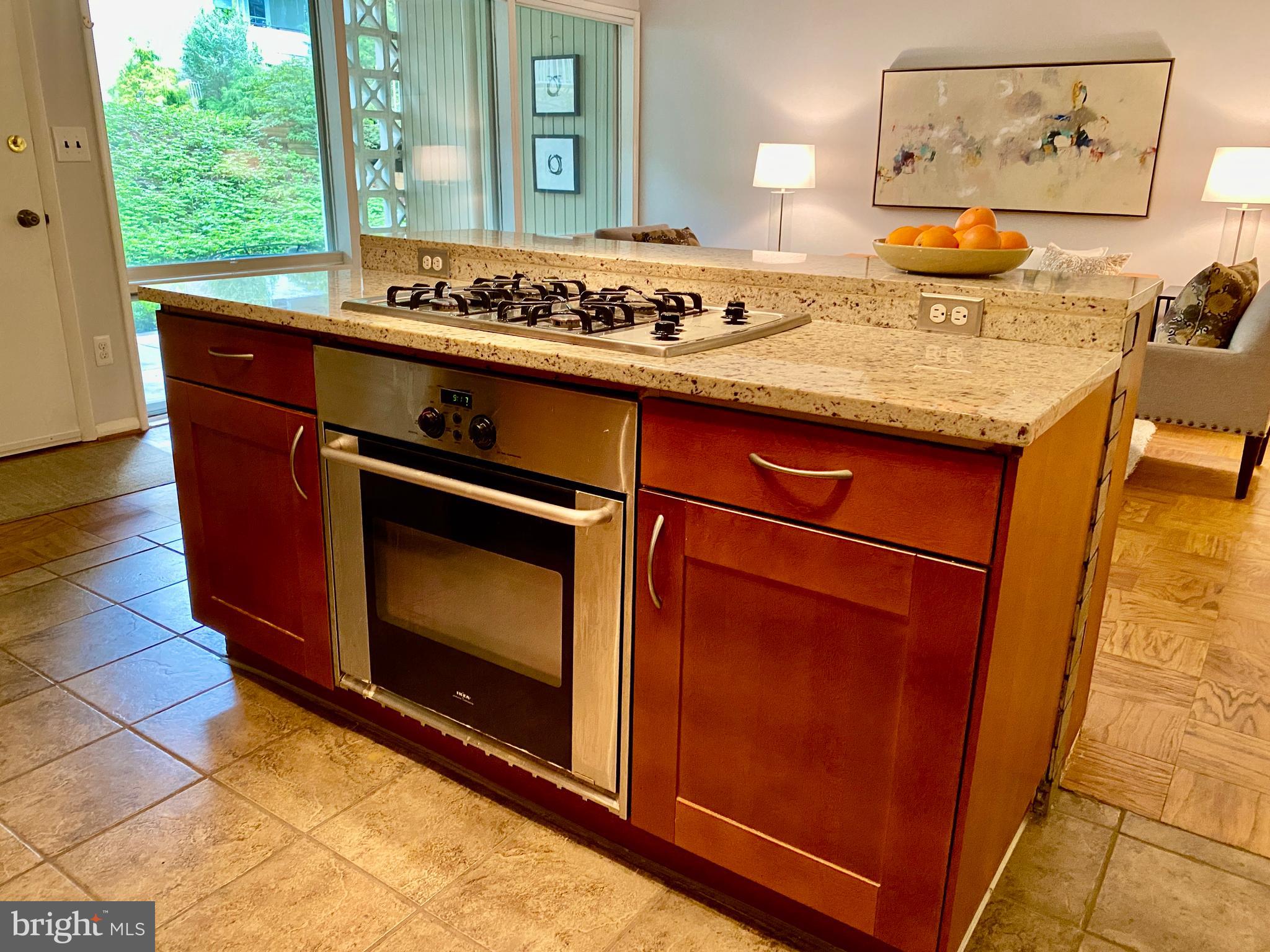 7519 Spring Lake Drive, Unit B1 Bethesda, MD 20817 - Photo 10 of 36 Island with gas cooktop and wall oven