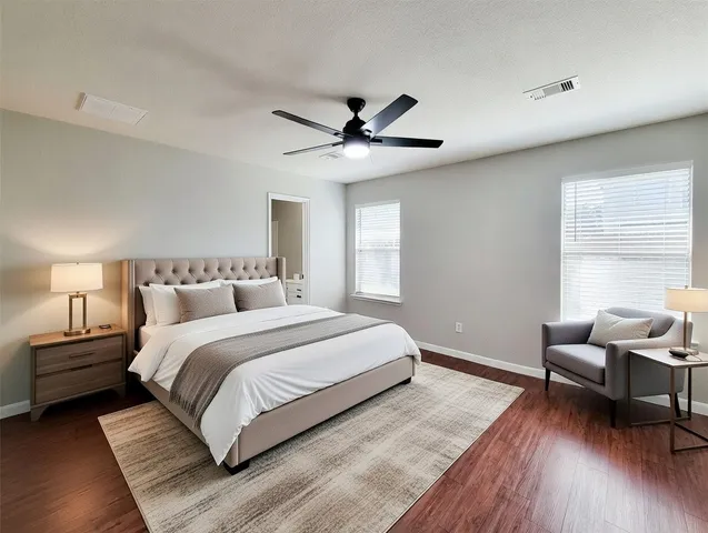a view of walk in closet with wooden floor