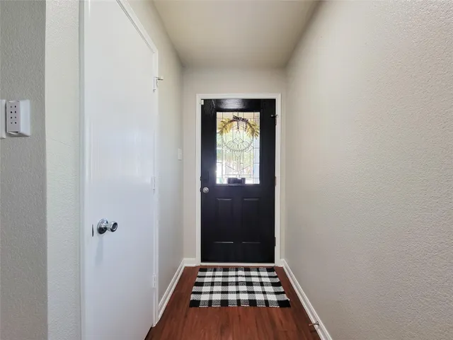a view of a bathroom with sink and window