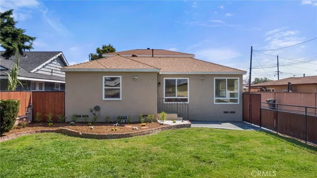 a front view of house with yard and outdoor seating