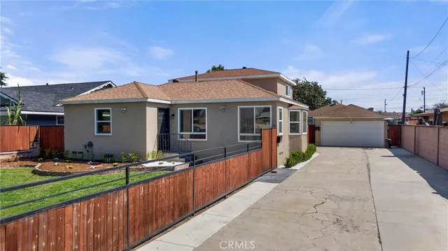 a front view of a house with yard