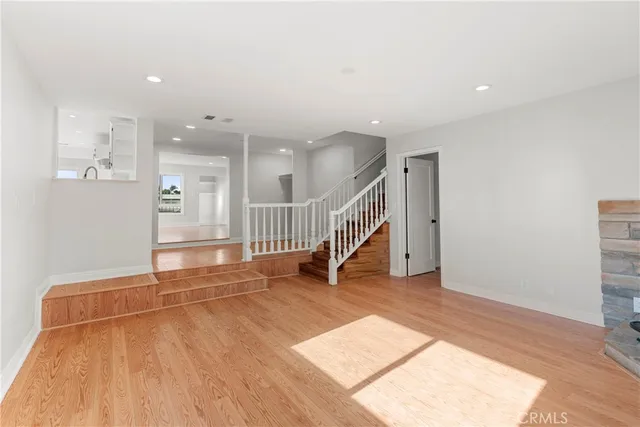 a view of an entryway with wooden floor