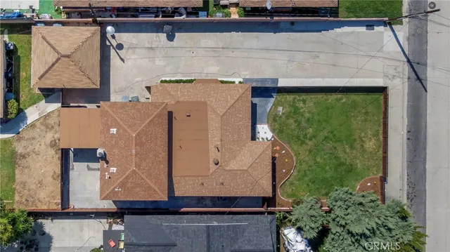 with aerial view of a house with a yard