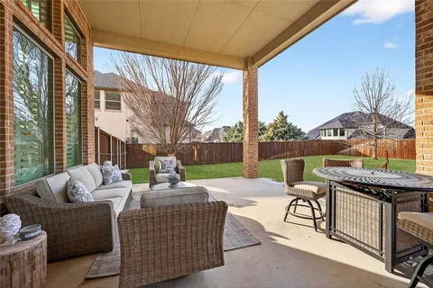 a outdoor space with patio furniture and a fireplace