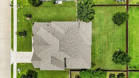 swimming pool view with a garden