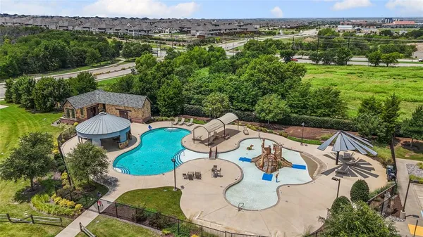 an aerial view of a house with outdoor space