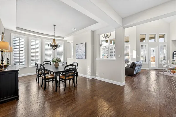 a view of a livingroom with furniture window and wooden floor