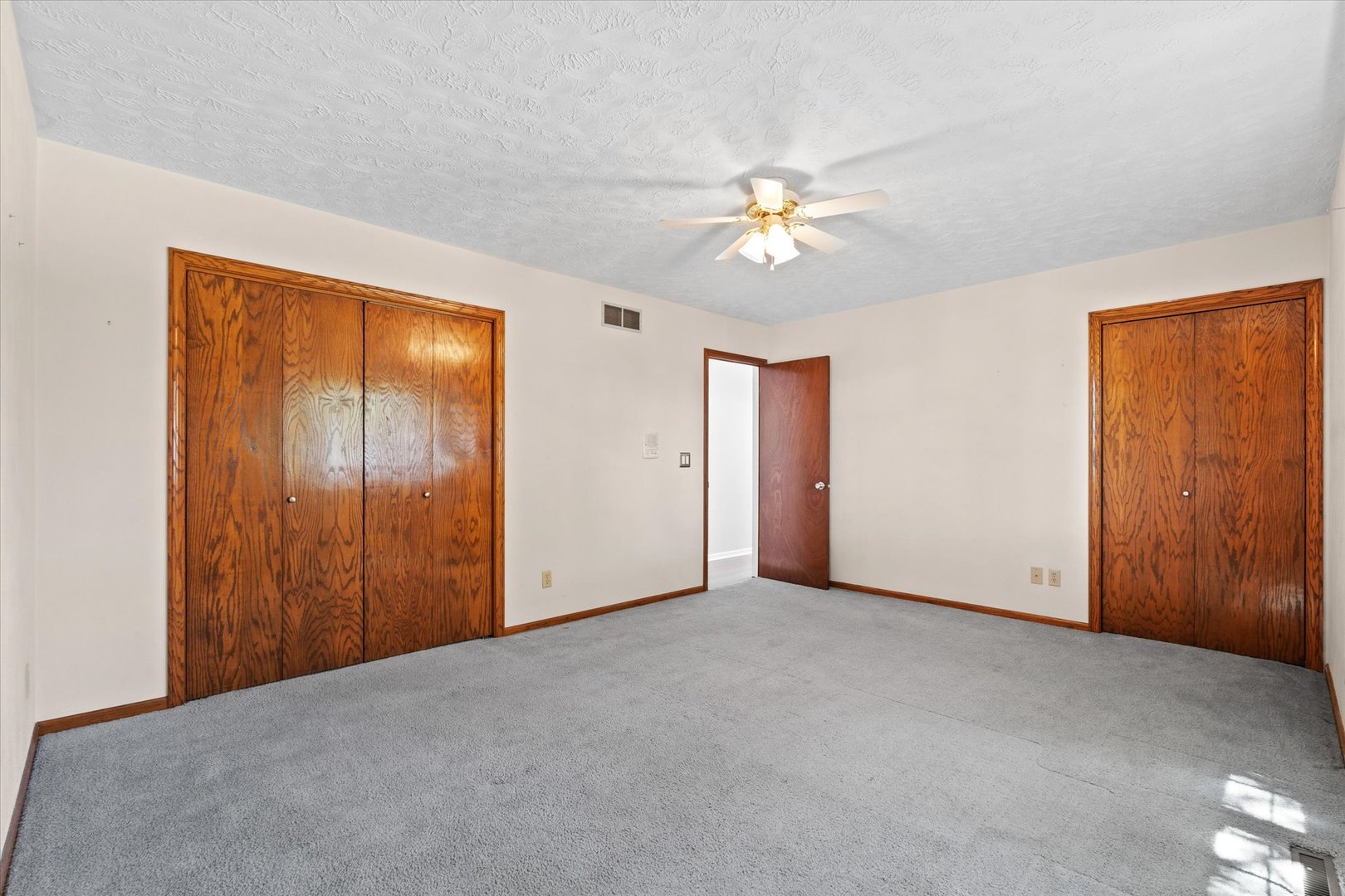 10 Oak Grove Road Geneseo, IL 61254 - Photo 27 of 43 a view of empty room with a ceiling fan
