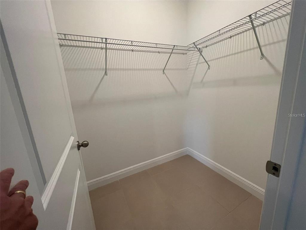 15087 Southwest 51st Terrace Ocala, FL 34473 - Photo 12 of 14 a view of a room with racks on the wall