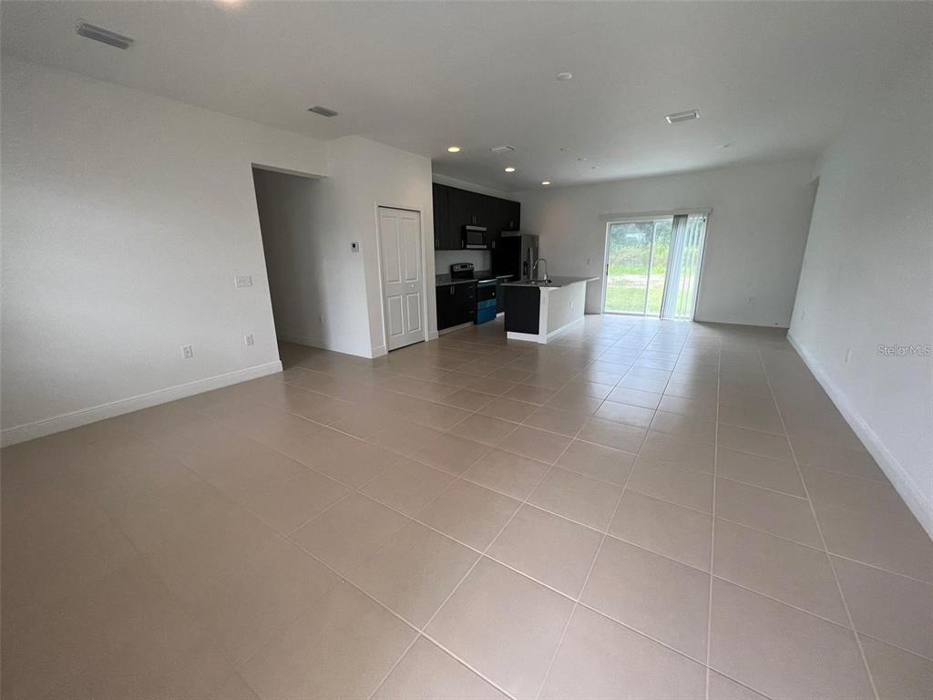 15087 Southwest 51st Terrace Ocala, FL 34473 - Photo 2 of 14 a view of an empty room with a window