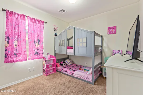 a bedroom with furniture and a bathtub