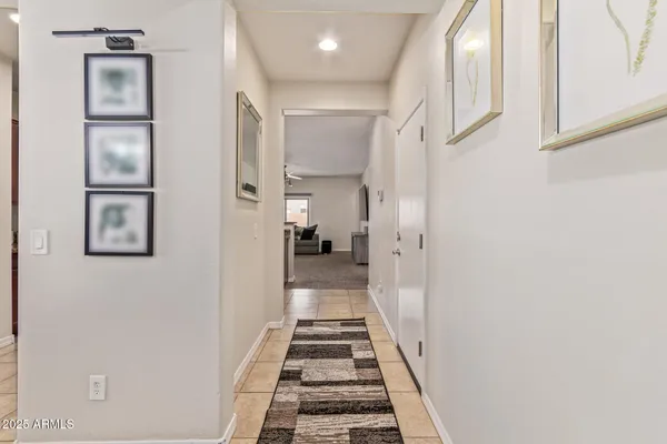 a view of a hallway with a white walls