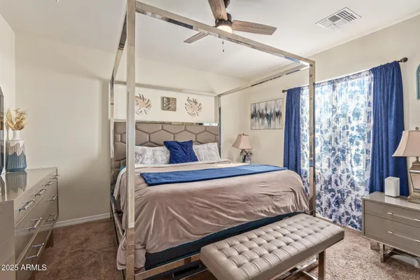 a bedroom with a bed and a table in it