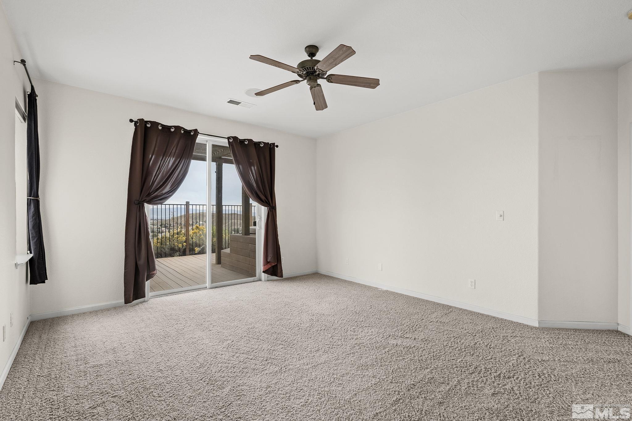 7144 Crest Hill Drive Reno, NV 89506 - Photo 15 of 28 a view of an empty room with a window