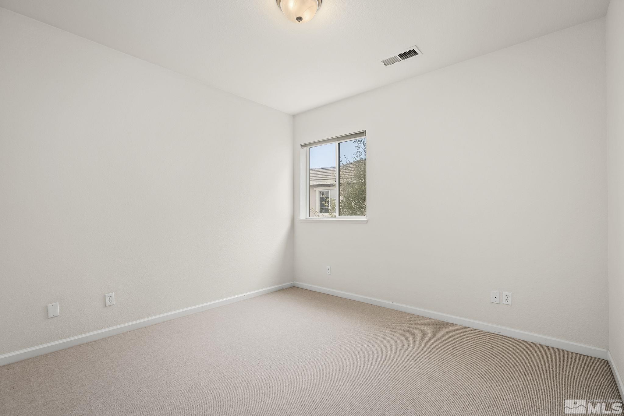 7144 Crest Hill Drive Reno, NV 89506 - Photo 19 of 28 an empty room with a window
