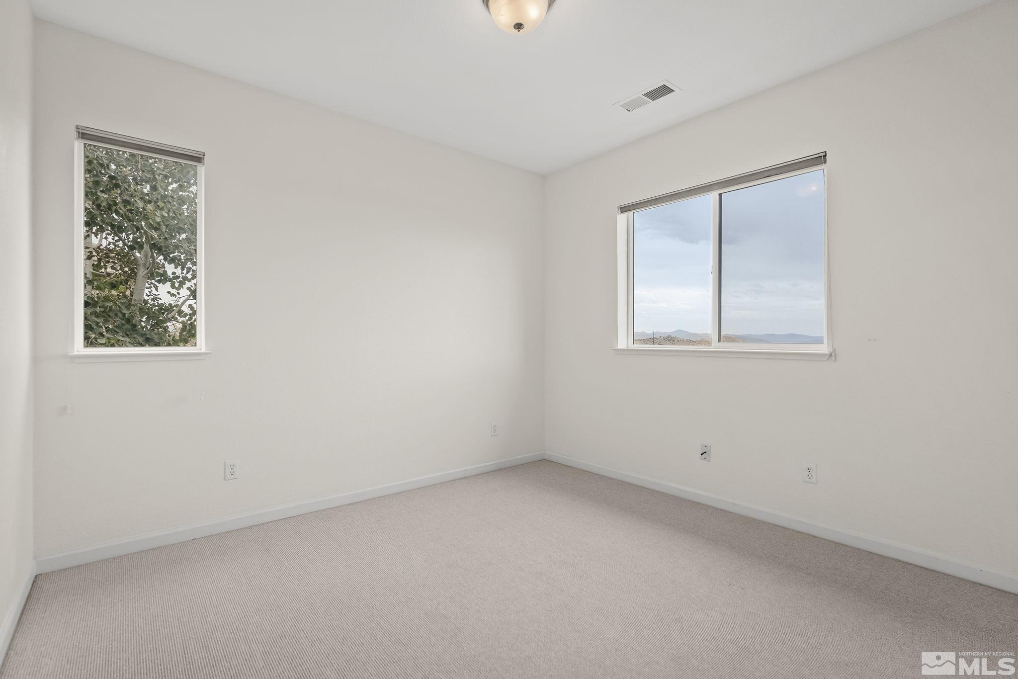 7144 Crest Hill Drive Reno, NV 89506 - Photo 20 of 28 an empty room with a window
