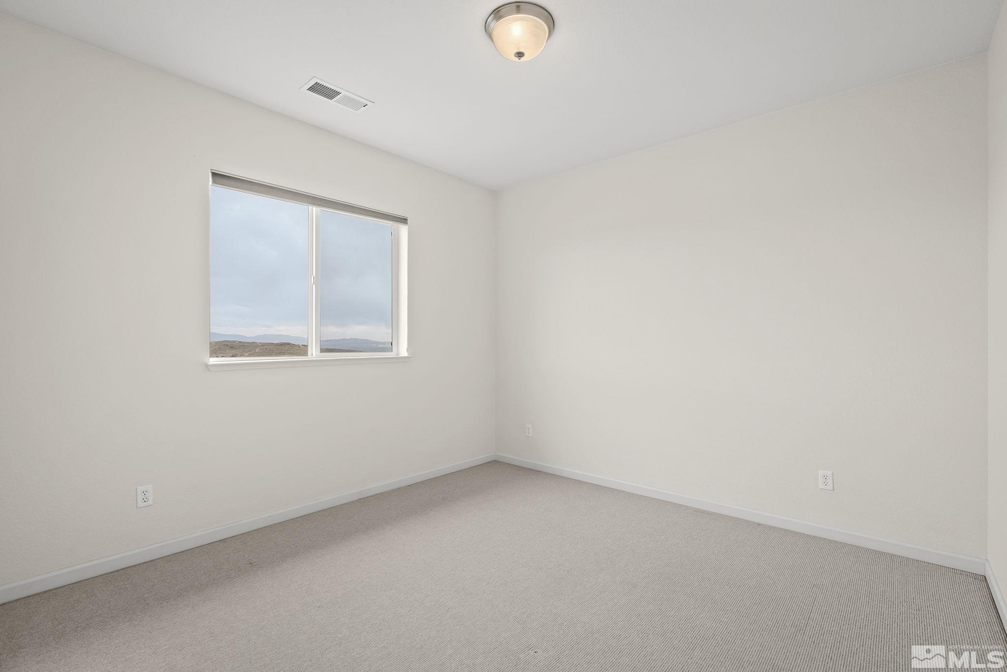 7144 Crest Hill Drive Reno, NV 89506 - Photo 21 of 28 an empty room with a window