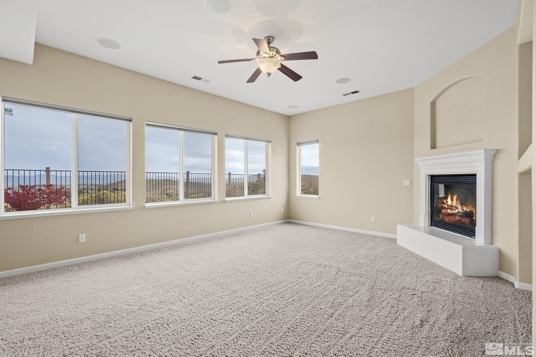 7144 Crest Hill Drive Reno, NV 89506 - Photo 3 of 28 a view of an empty room with a window