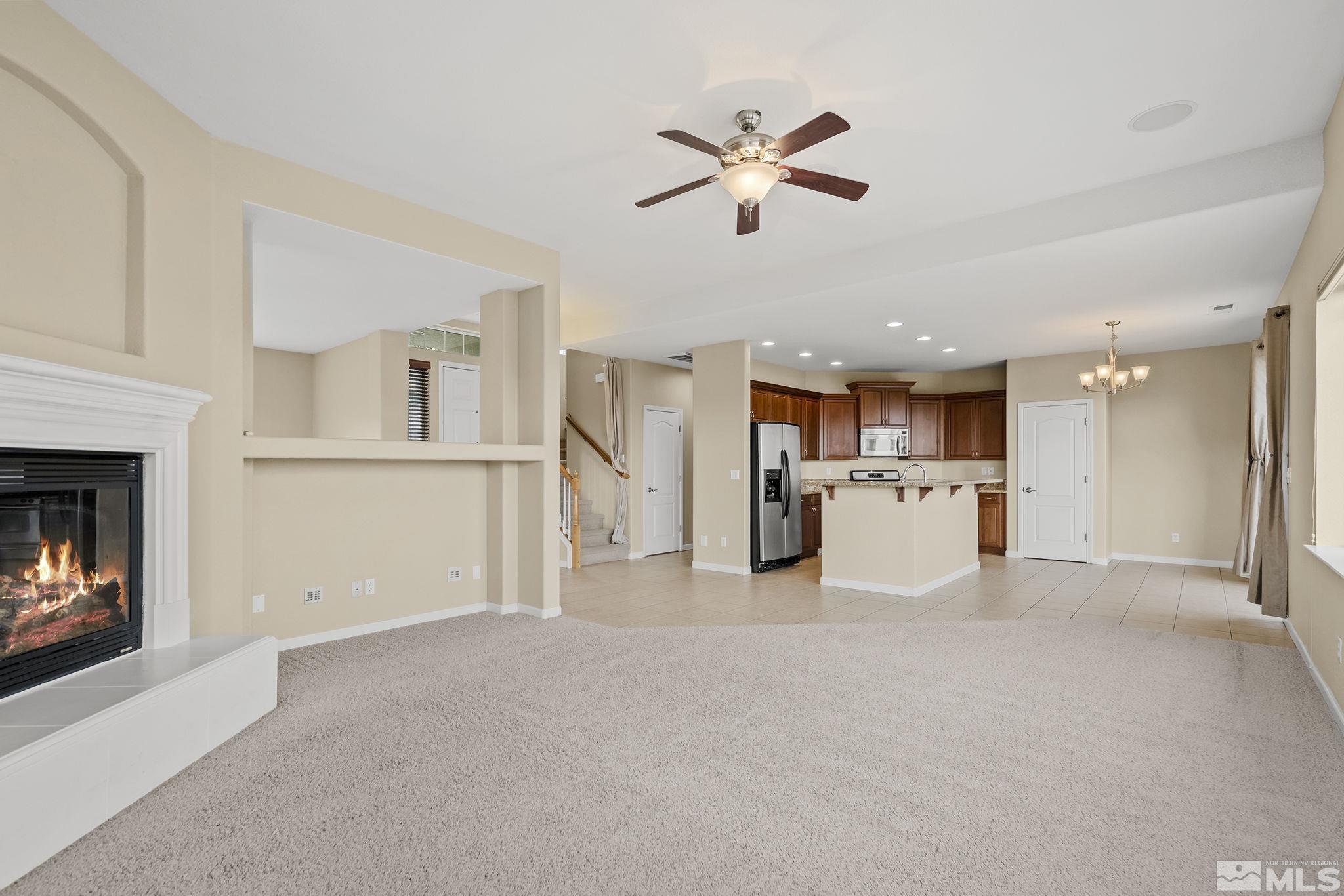 7144 Crest Hill Drive Reno, NV 89506 - Photo 5 of 28 a view of a kitchen with a sink cabinets and a fireplace