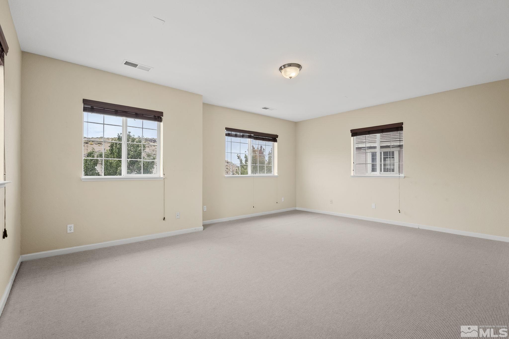 7144 Crest Hill Drive Reno, NV 89506 - Photo 9 of 28 a view of an empty room with windows