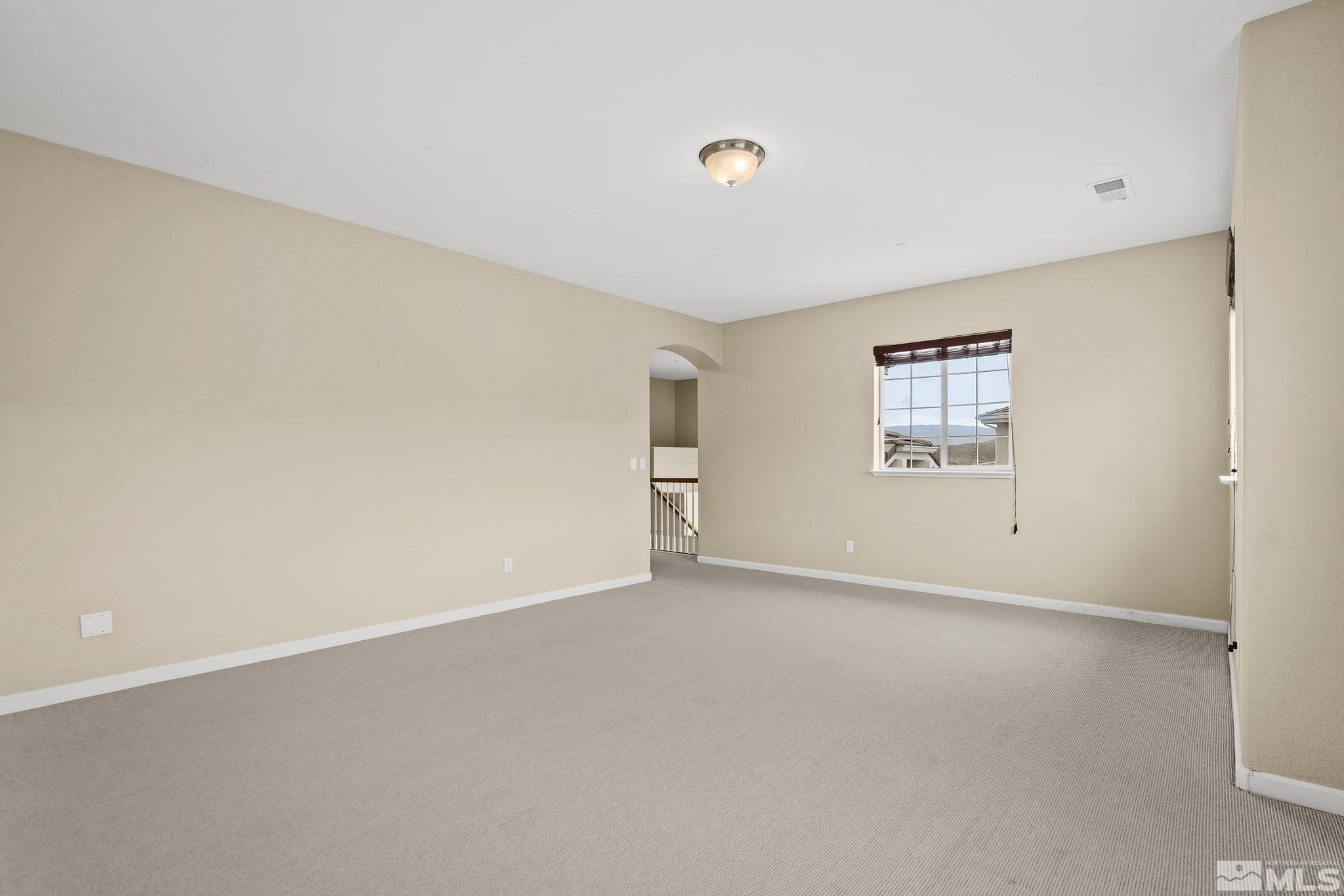 7144 Crest Hill Drive Reno, NV 89506 - Photo 10 of 28 an empty room with windows