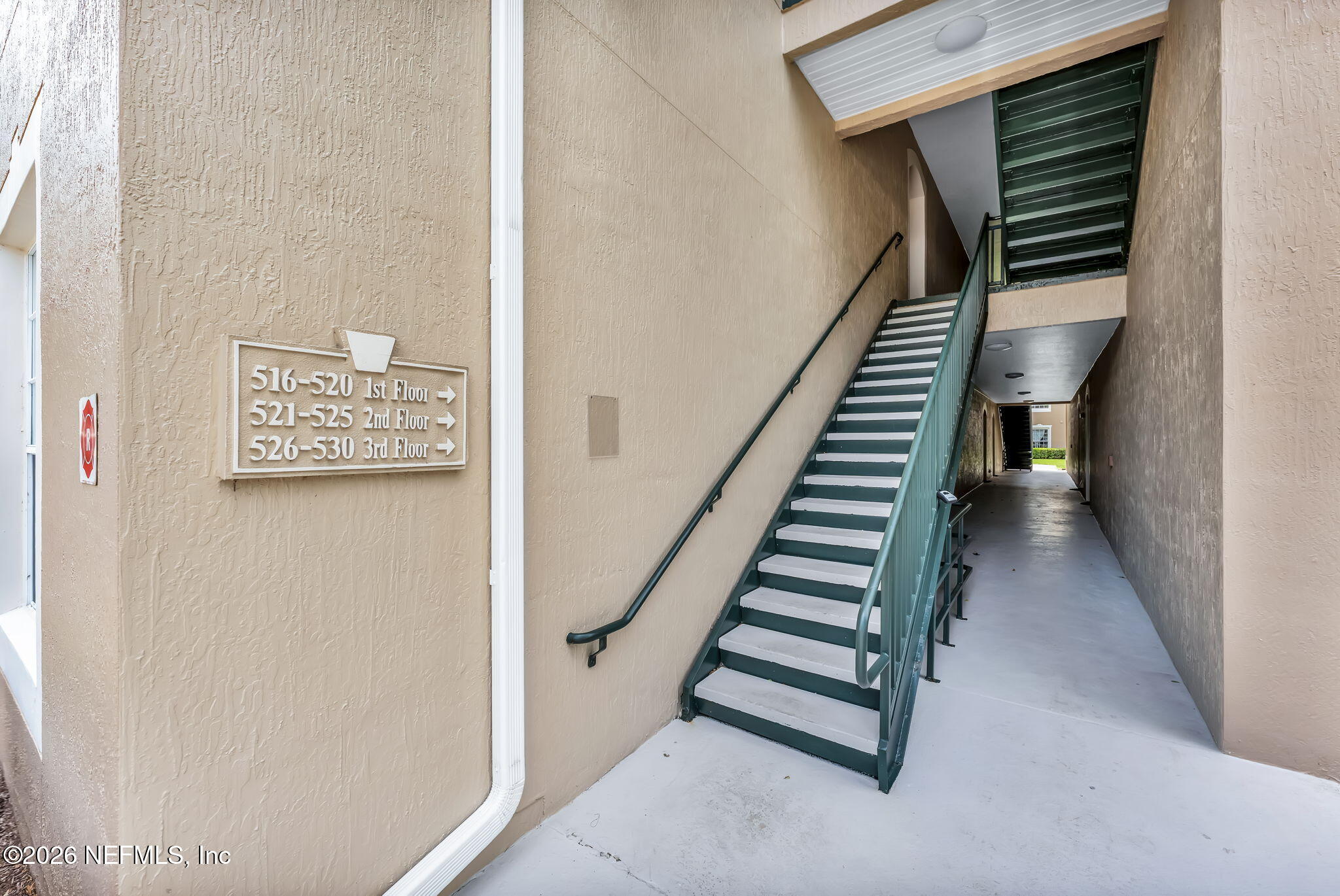 7990 Baymeadows Road East, Unit 520 Jacksonville, FL 32256 - Photo 2 of 41 a view of entryway and hall with wooden floor