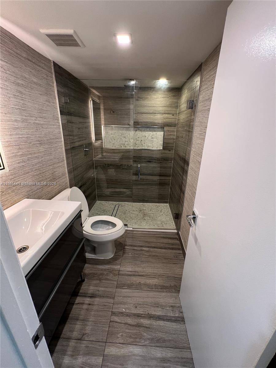California Club Miami, FL 33179 - Photo 16 of 21 a bathroom with a sink and toilet