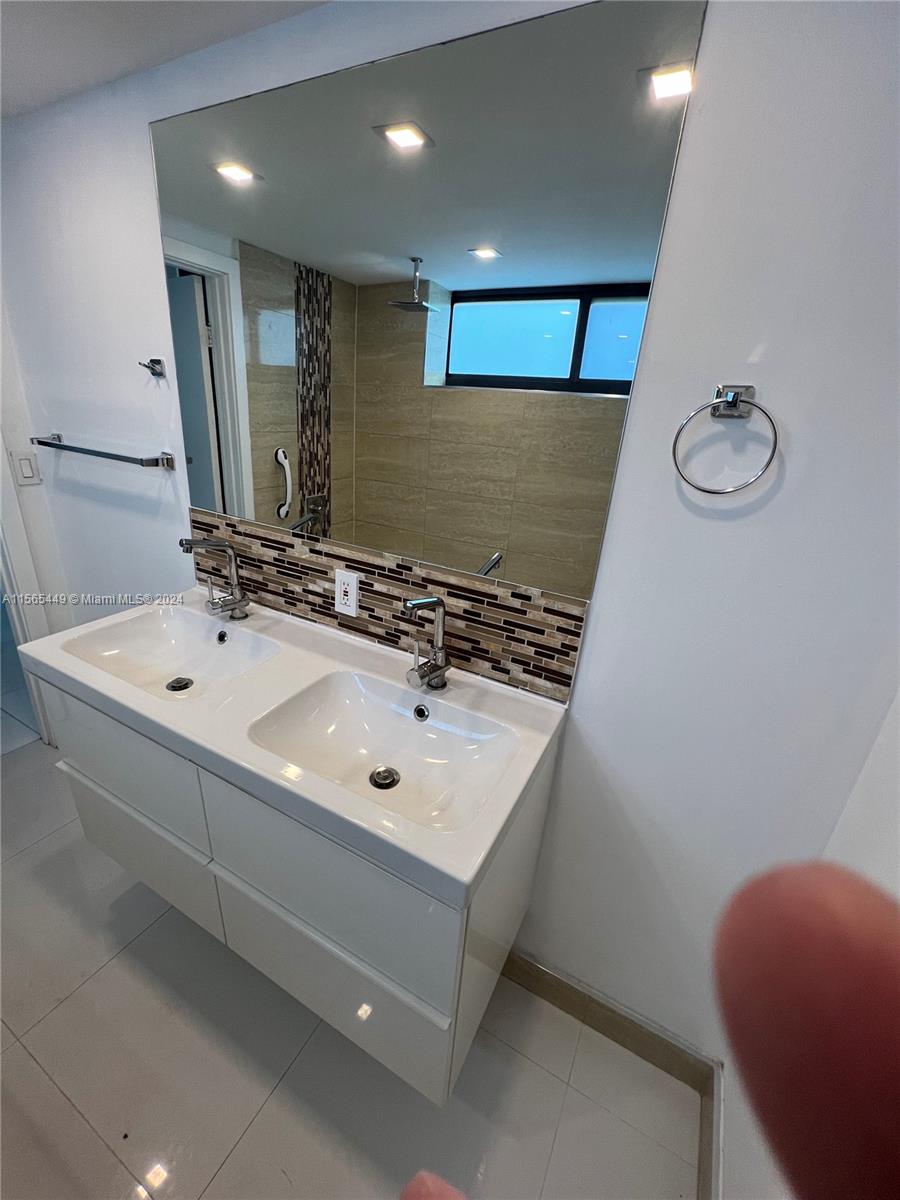 California Club Miami, FL 33179 - Photo 21 of 21 a bathroom with a sink and a mirror