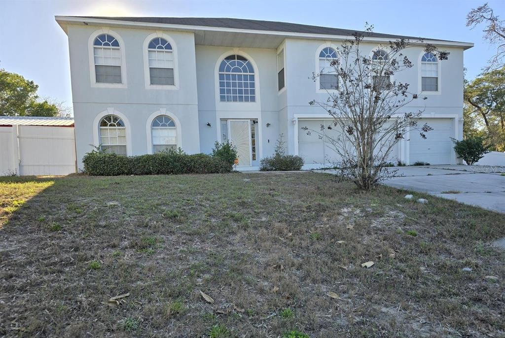 a view of front door of house and yard