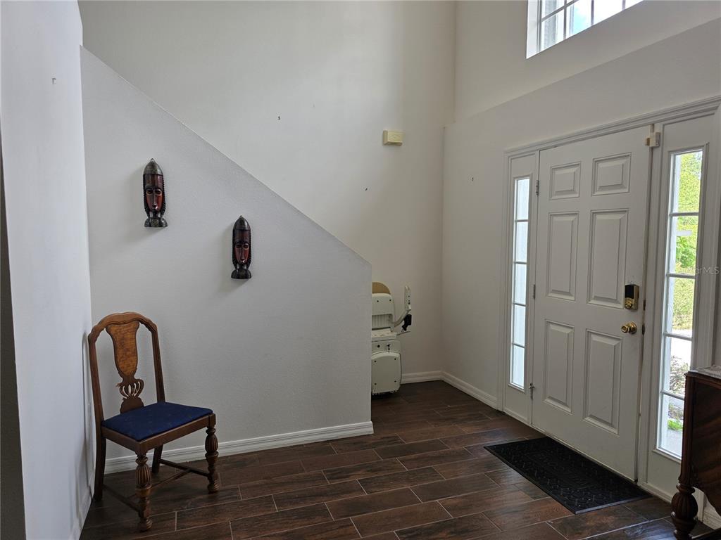 9276 Elm Court Spring Hill, FL 34606 - Photo 2 of 35 a view of a room with wooden floor bathroom and windows