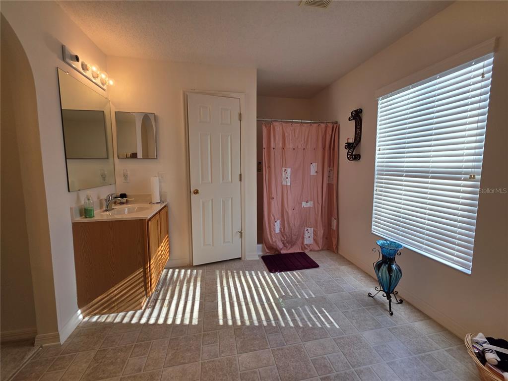 9276 Elm Court Spring Hill, FL 34606 - Photo 29 of 35 a view of a hallway with entryway and a window