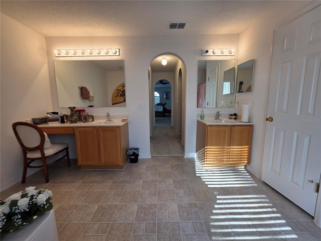 9276 Elm Court Spring Hill, FL 34606 - Photo 31 of 35 a living room with a sink chairs and kitchen view