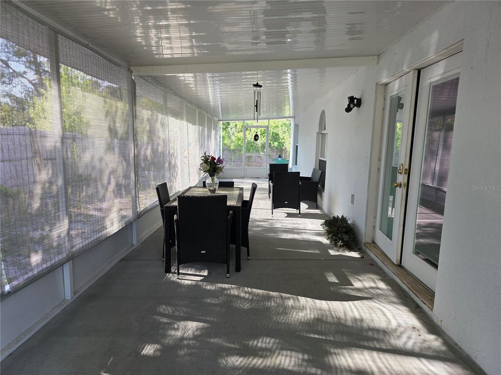 9276 Elm Court Spring Hill, FL 34606 - Photo 32 of 35 a view of a dining room with furniture window and outside view
