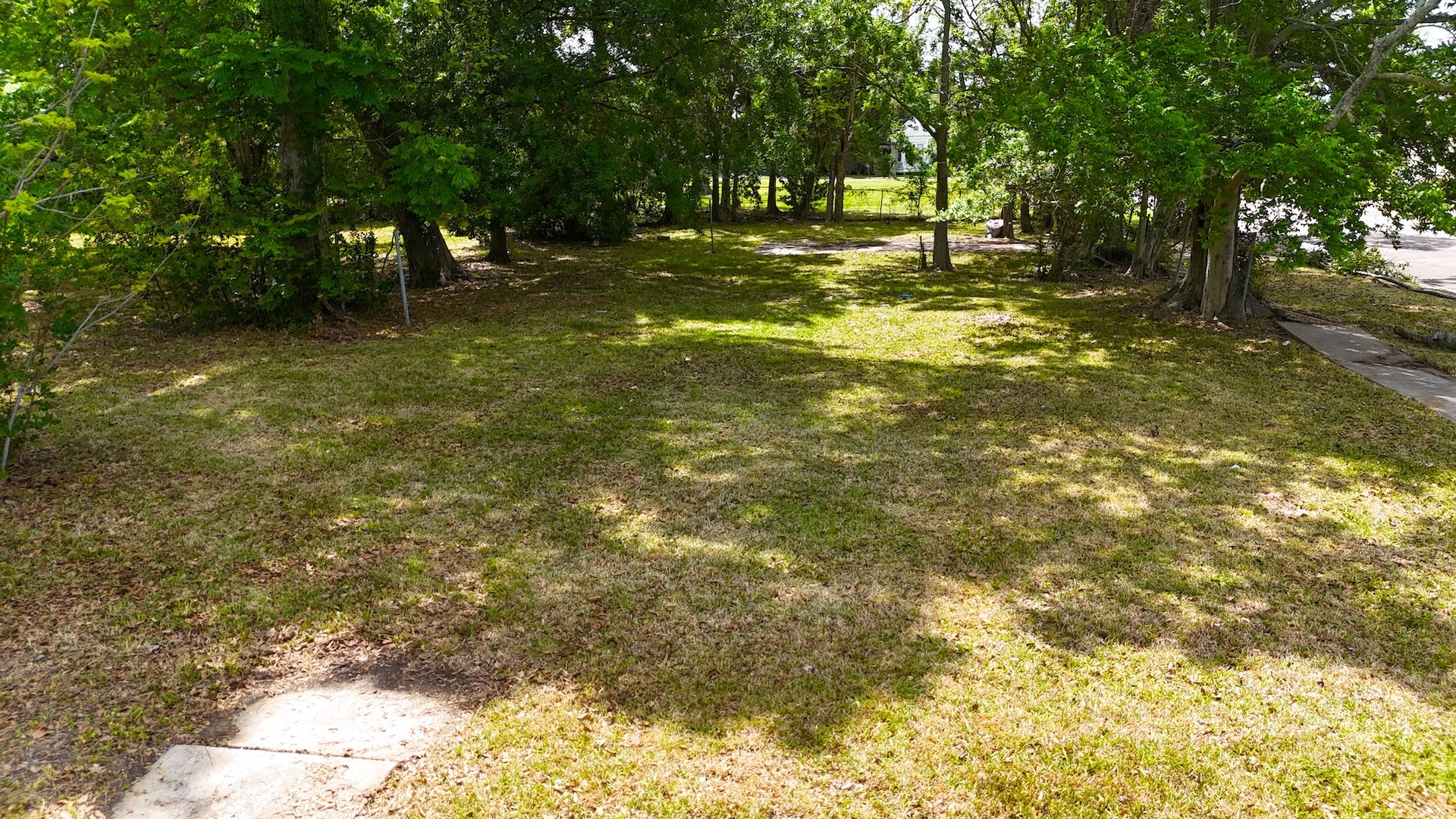 360 Center Street Beaumont, TX 77701 - Photo 4 of 6 a swimming pool with trees in the background