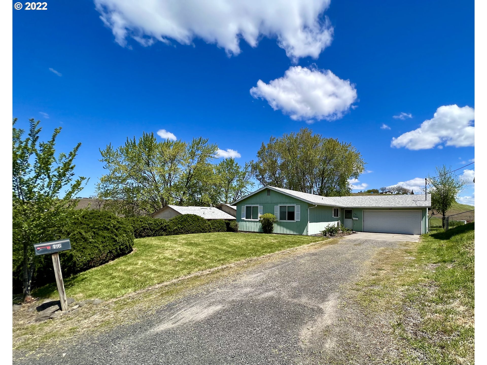 716 Southeast 10th Street Pendleton, OR 97801 - Photo 1 of 18 a view of a house with a yard