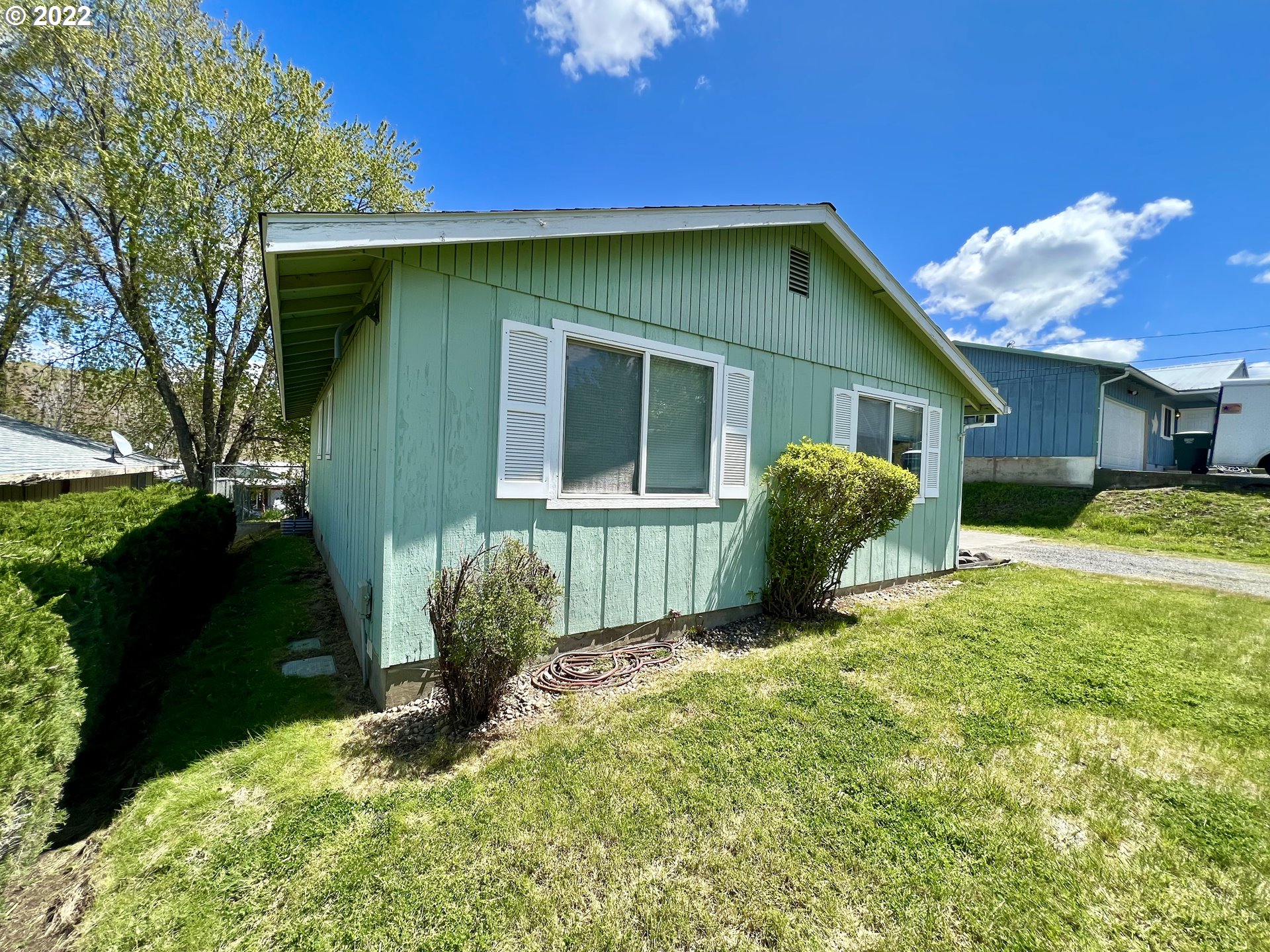 716 Southeast 10th Street Pendleton, OR 97801 - Photo 3 of 18 a view of a house with backyard and a tree