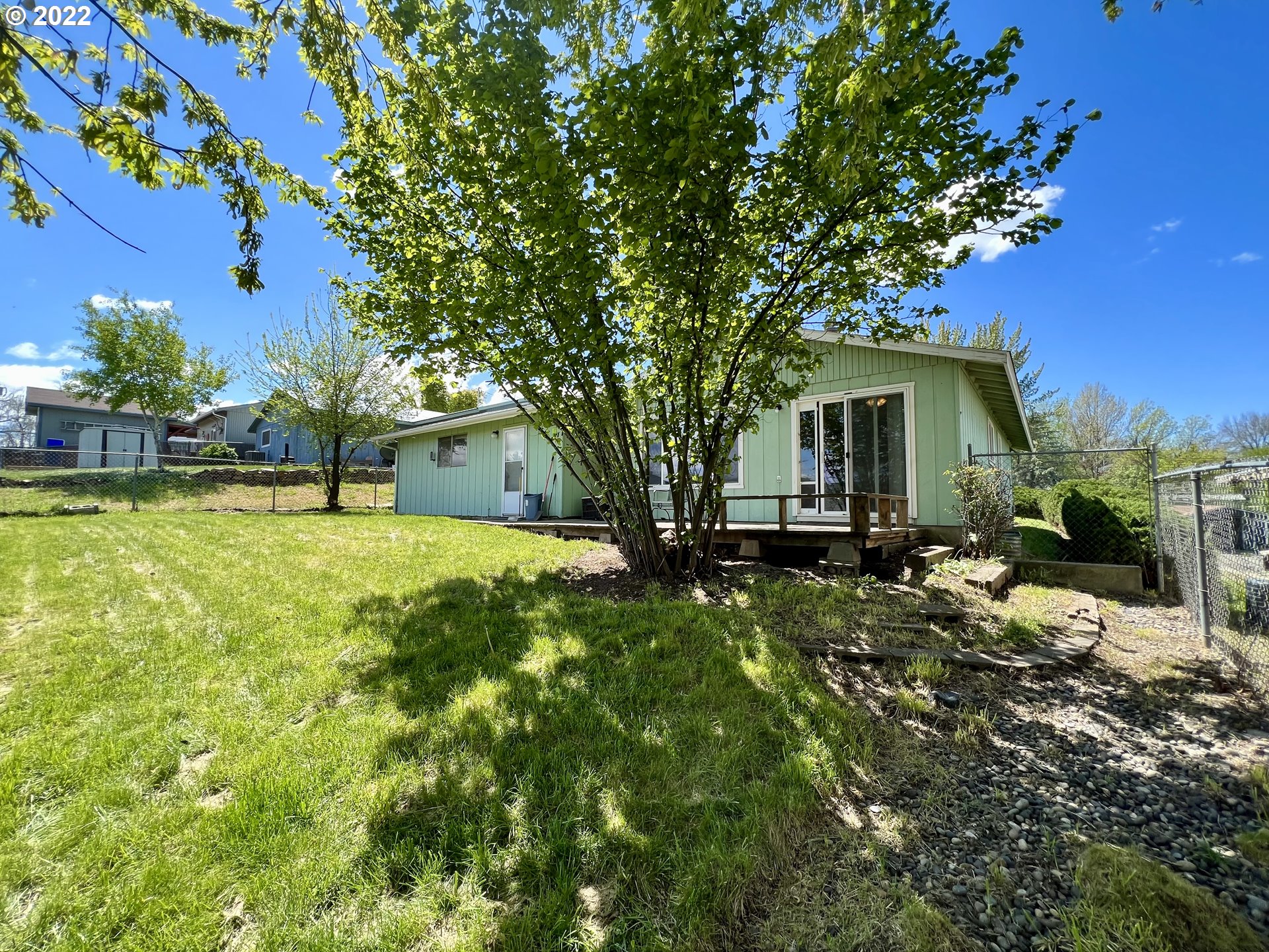 716 Southeast 10th Street Pendleton, OR 97801 - Photo 5 of 18 a view of a house with a backyard