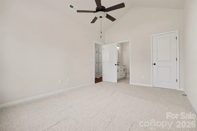 a view of an empty room with a fan