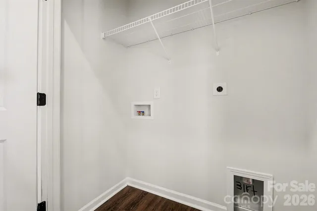 a view of a small space with wooden floor