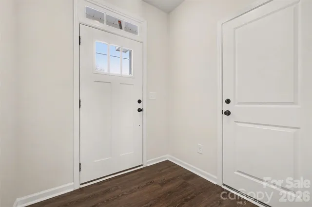 an empty room with wooden floor