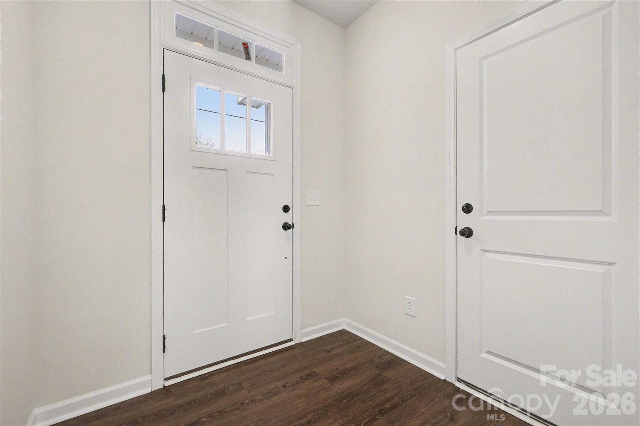 508 Mill Street Lowell, NC 28098 - Photo 3 of 27 an empty room with wooden floor