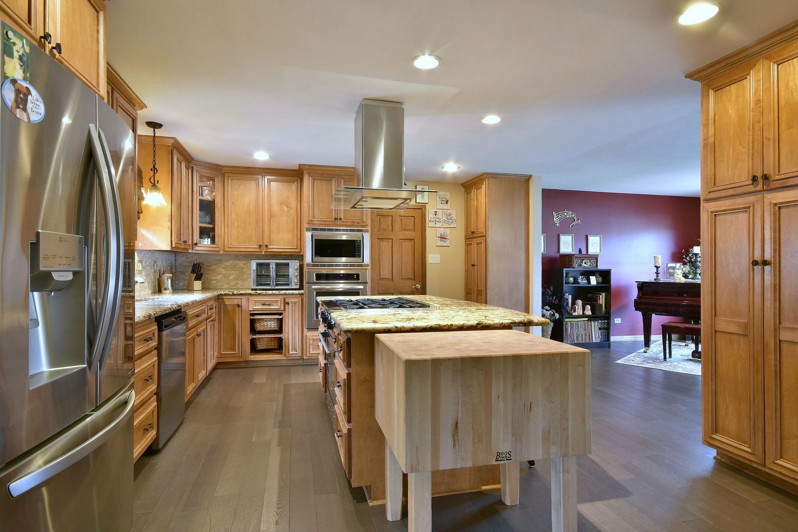 18824 Ruth Drive Mokena, IL 60448 - Photo 15 of 29 a kitchen with stainless steel appliances kitchen island granite countertop a stove refrigerator and cabinets