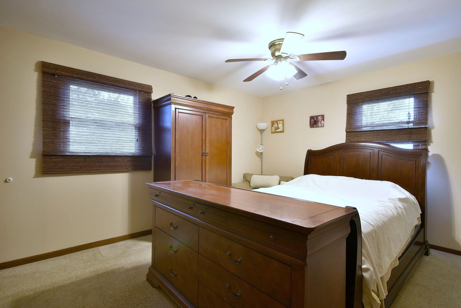18824 Ruth Drive Mokena, IL 60448 - Photo 17 of 29 a bedroom with a bed and a chandelier